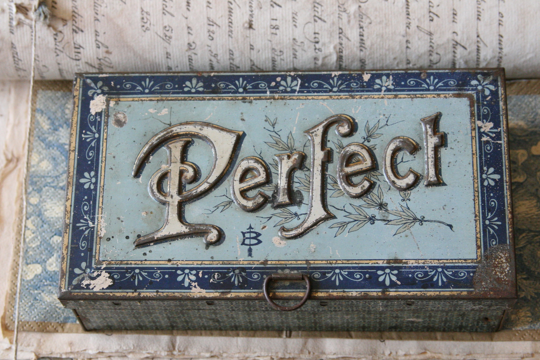 A french antique tin can used for holding stamps and ink for printing
