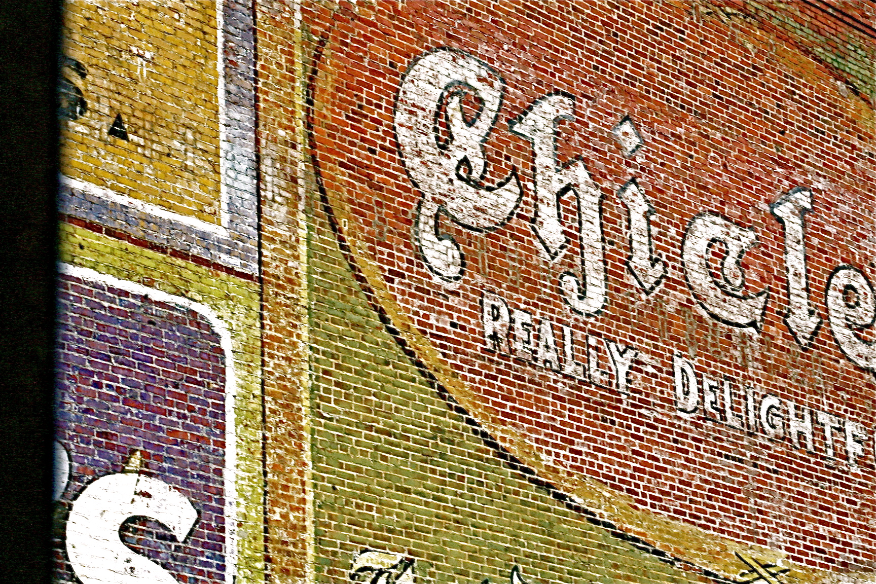 billboard on brick wall