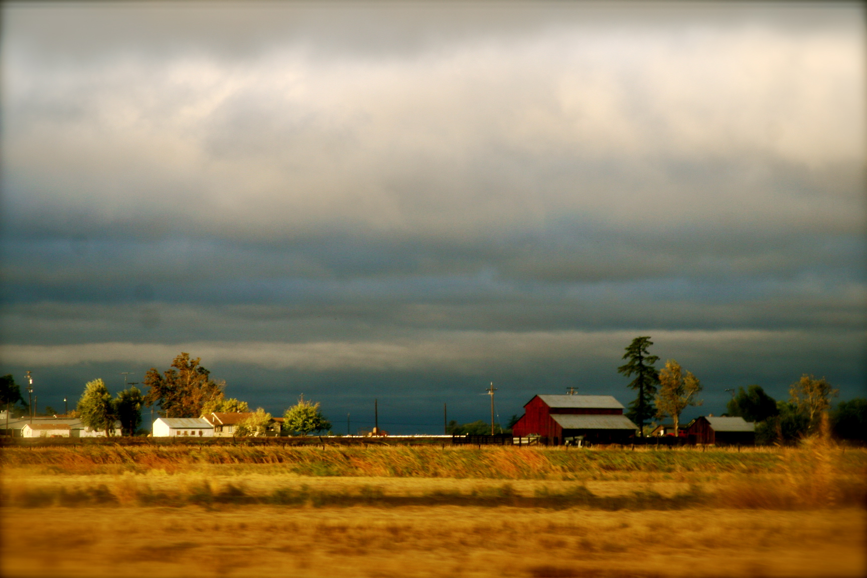 autumn storm over farm land