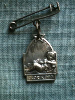 Baby with a Star above Him Medal