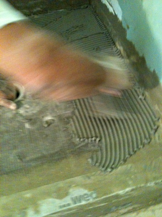 Laying tiles, France. Laying tiles, France.