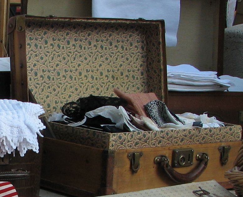 old suitcase with linens old suitcase with linens