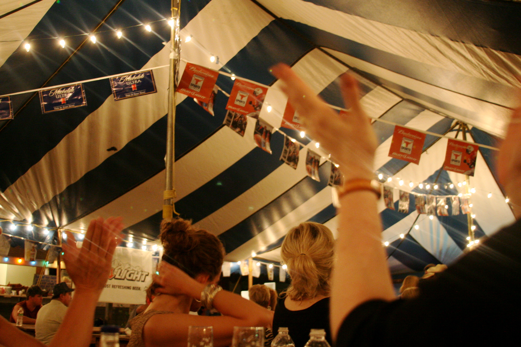 under a blue stripped tent Zapp Hall