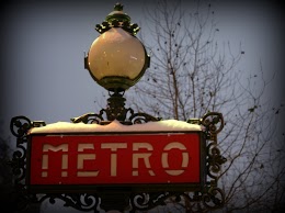 Paris Metro Sign in the snow, by Chelsea