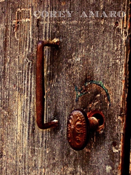 Iron door handle on a wooden door