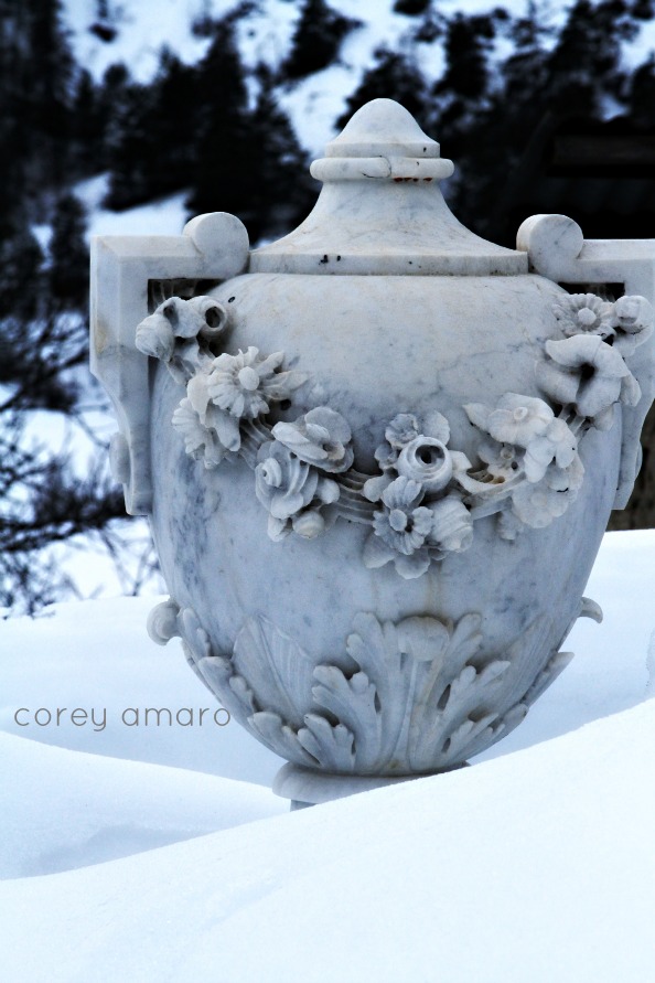 Marble urn in the snow Marble urn in the snow